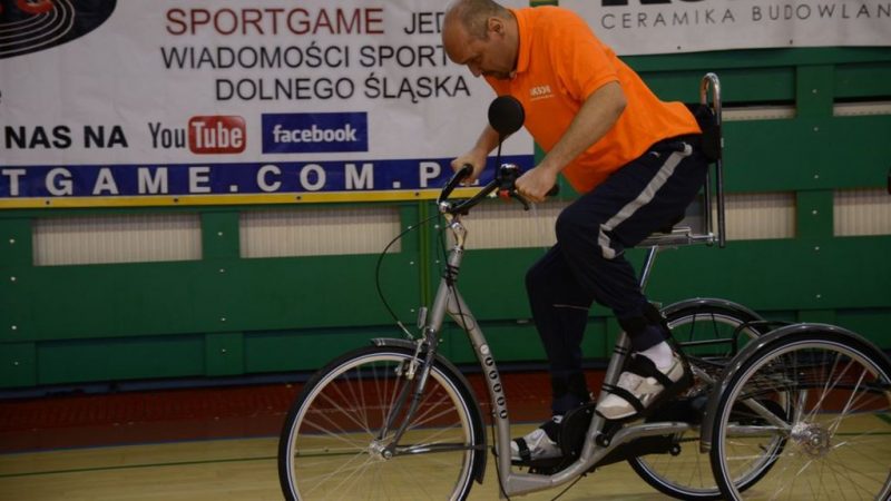 Paralyzed man rides a bike after a cell transplant in Poland.